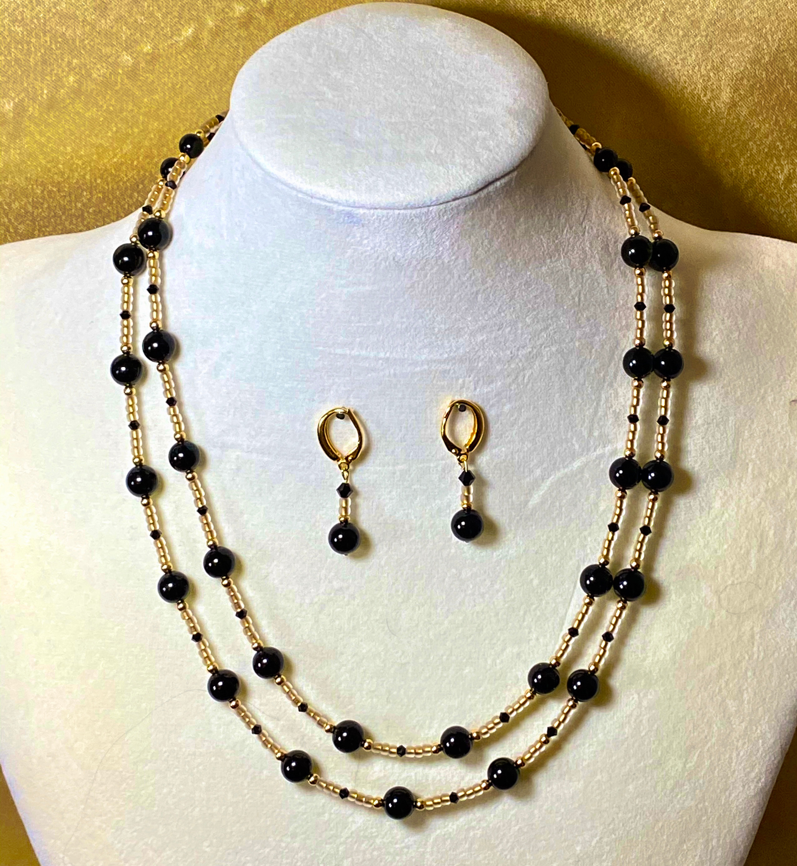 Picture of Black and Gold Crystal Necklace and Earrings